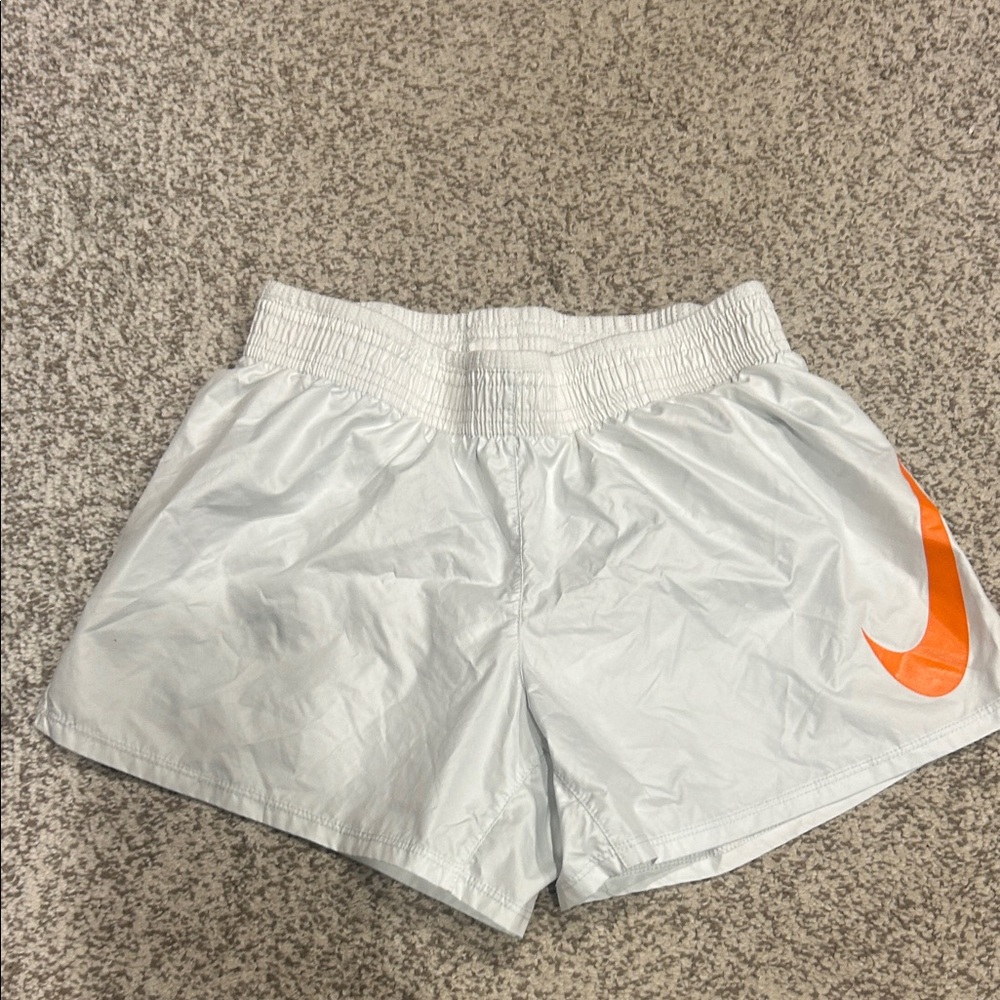 Nike Women's Athletic Shorts in White with Orange Logo